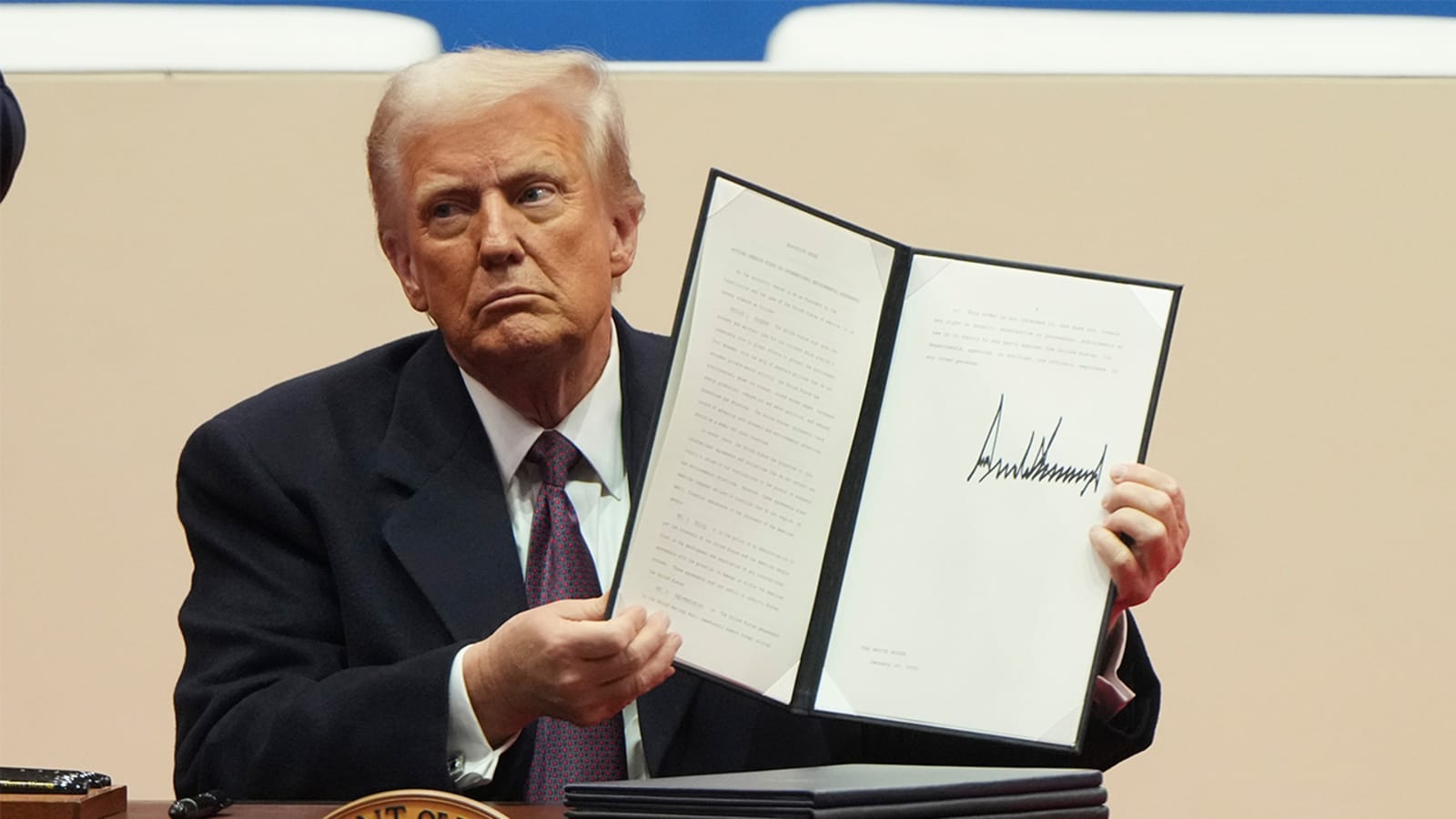 President Trump signing a document