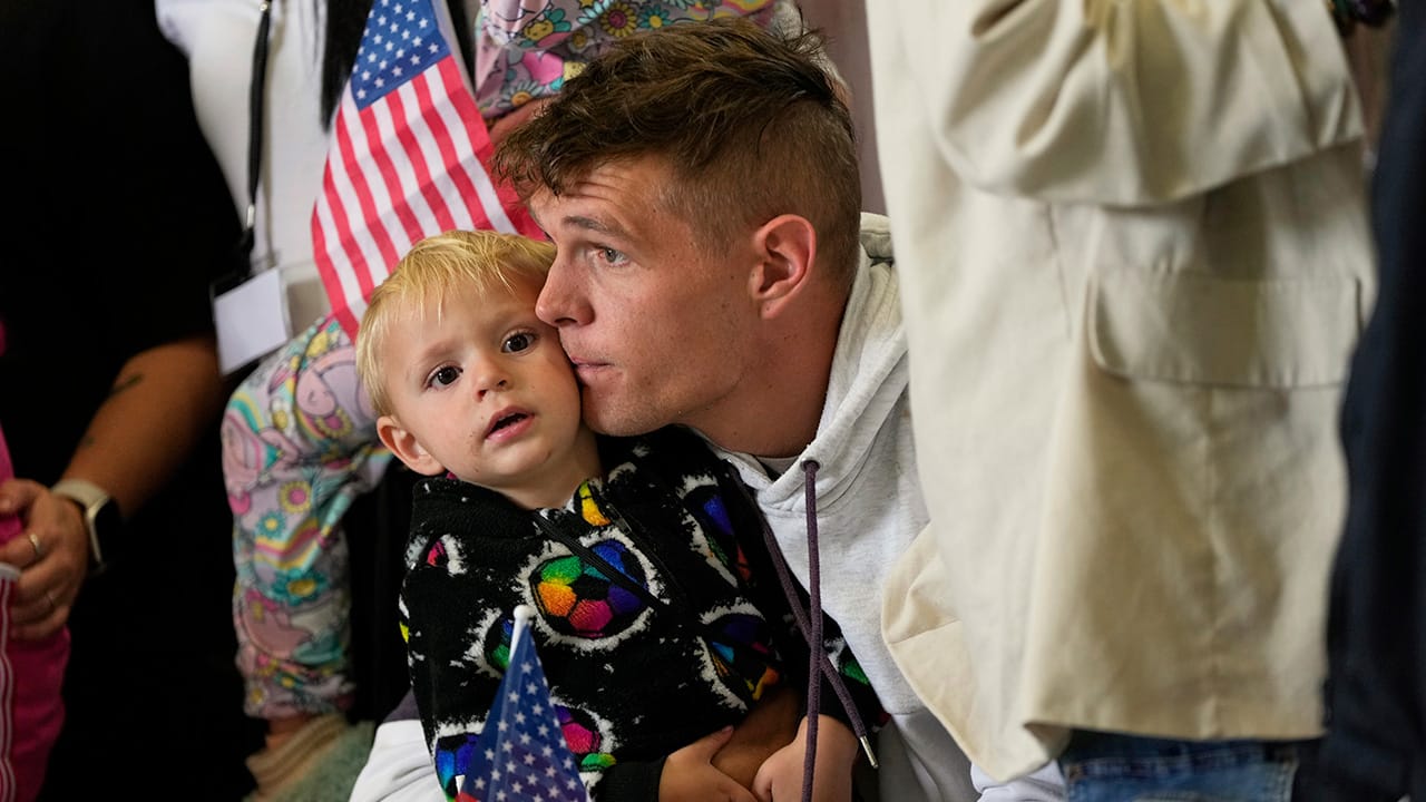 Afrikaner refugees with US flags