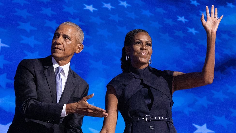 Barack and Michelle Obama speaking at event
